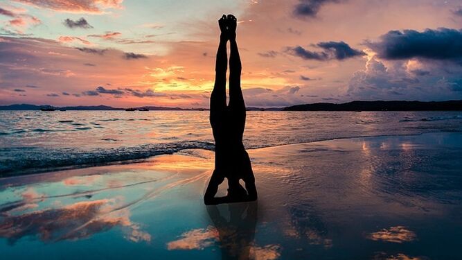 yoga-stand-in-hands-silhouette-2149407_640