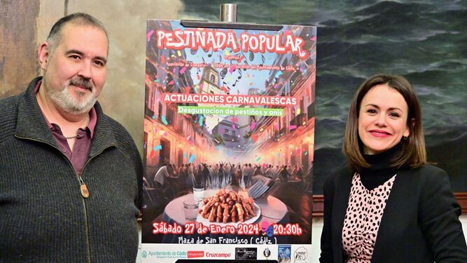 Humberto González y Beatriz Gandullo con el cartel de la Pestiñada Popular.